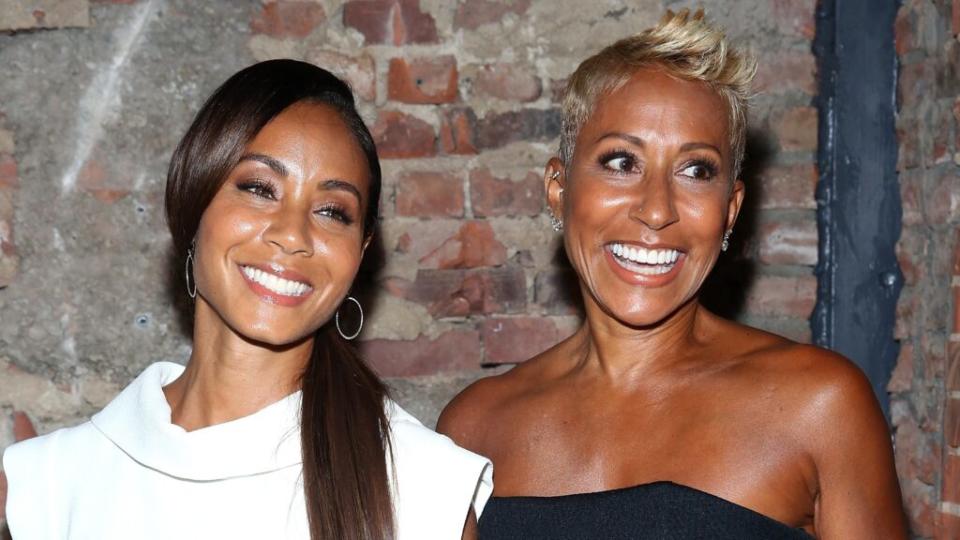 Actress Jada Pinkett Smith (left) and her mother, Adrienne Banfield-Norris, two-thirds of the “Red Table Talk” show, pose backstage at a 2014 Christian Siriano fashion show during Mercedes-Benz Fashion Week in New York City. (Photo by Cindy Ord/Getty Images)