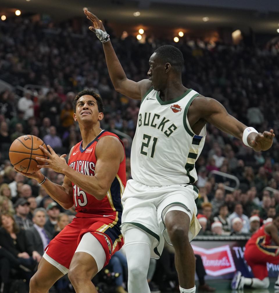 New Orleans Pelicans' Frank Jackson tries to shoot with Milwaukee Bucks' Tony Snell defending during the first half of an NBA basketball game Wednesday, Dec. 19, 2018, in Milwaukee. (AP Photo/Morry Gash)