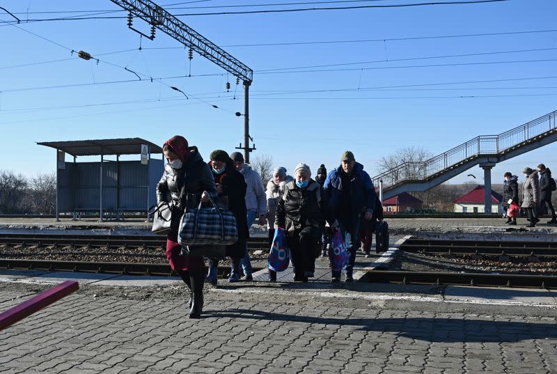 FILE PHOTO: People evacuated from the self-proclaimed Donetsk People's Republic arrive at a railway station in the Rostov region