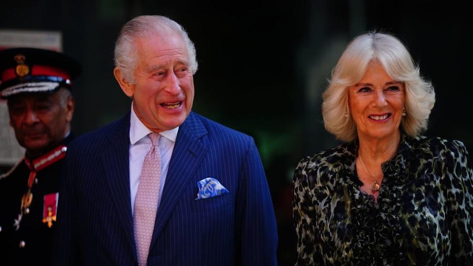 King Charles and Queen Camilla smile as they arrive at the hospital in central London