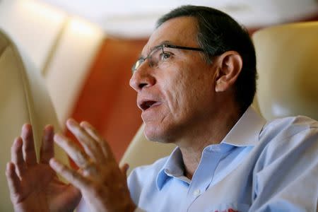Peru's President Martin Vizcarra speaks during an interview with Reuters on board the presidential plane returning from Madre de Dios to Lima, Peru May 17, 2019. REUTERS/Guadalupe Pardo