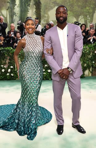 <p>Jamie McCarthy/Getty </p> Gabrielle Union and Dwyane Wade attend the 2024 Met Gala at the Metropolitan Museum of Art in New York City on May 6, 2024