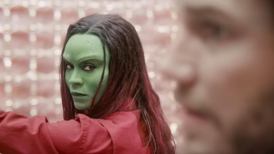 Gamora with her arm held out looks at Quill in Guardians of the Galaxy Vol. 3