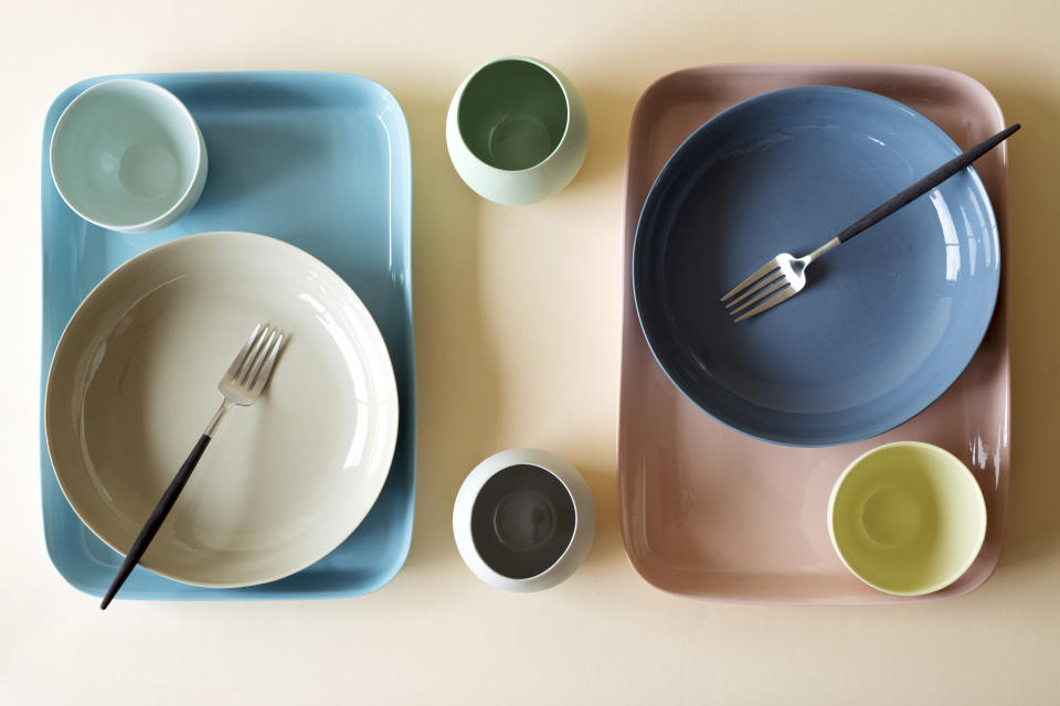 This image provided by Mud Australia shows dining plates. Mud Australia has matte-finish ceramic pieces in soft hues like pistachio, duck egg, mist, and blossom, that would make a dreamy set to dine on. Many chefs are using creative dishware designed with irregular shapes and unusual colors to help create a mood. (Becca Crawford/Mud Australia via AP).