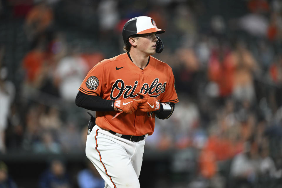 Baltimore Orioles' Adley Rutschman heads to first on a walk during the sixth inning of the team's baseball game against the Tampa Bay Rays on Saturday, May 21, 2022, in Baltimore. (AP Photo/Gail Burton)