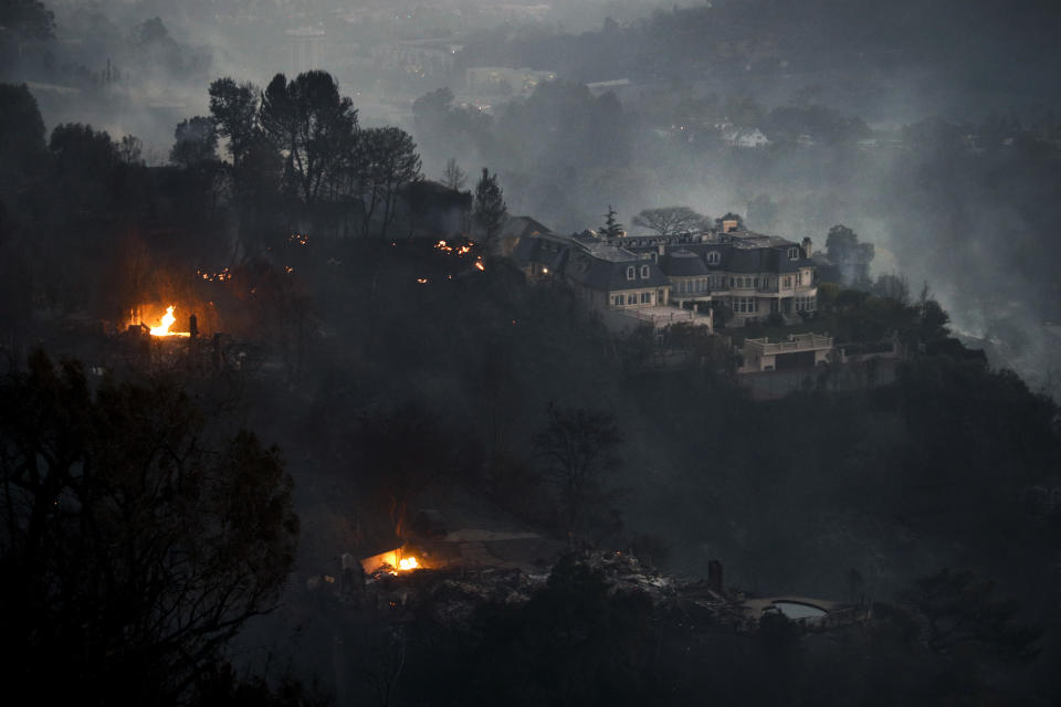 <p>A mansion that survived a wildfire sits on a hilltop in the Bel Air district of Los Angeles Wednesday, Dec. 6, 2017. (Photo: Jae C. Hong/AP) </p>