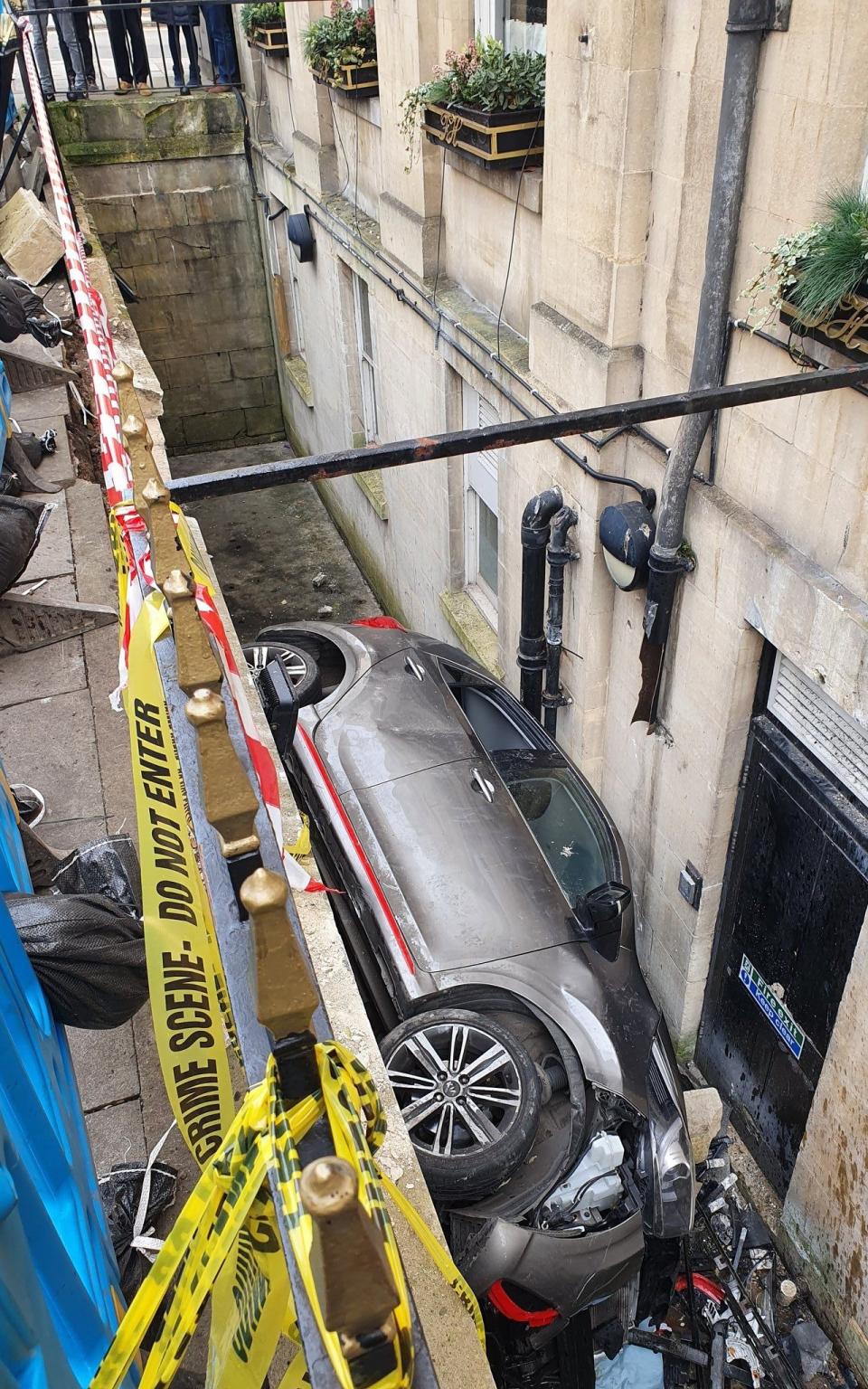 Car trapped outside hotel Bristol - Twitter/@TouristHeaven