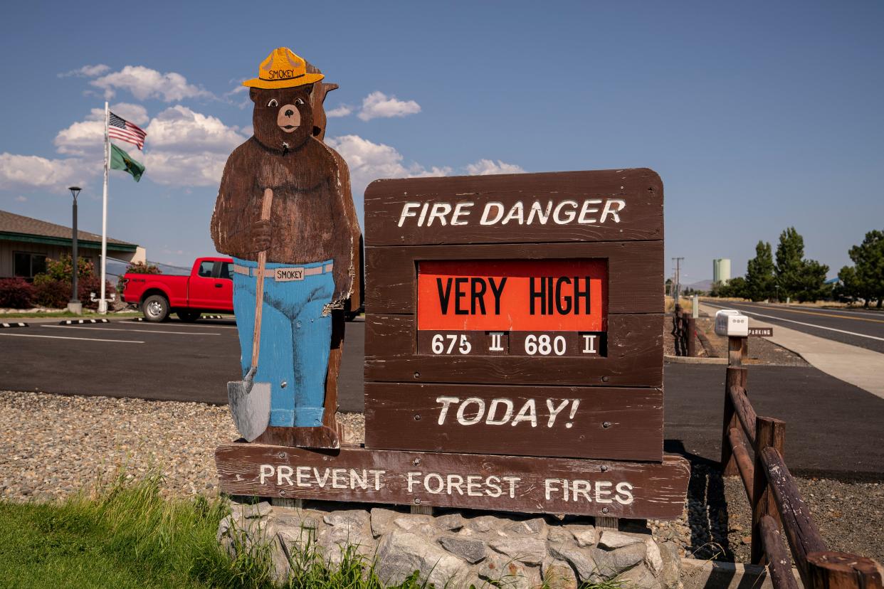 A sign warns of very high fire danger during soaring temperatures on July 28 in Ellensburg, Wash. The Pacific Northwest continues to experience a heat wave bringing record-breaking temperatures in some areas.