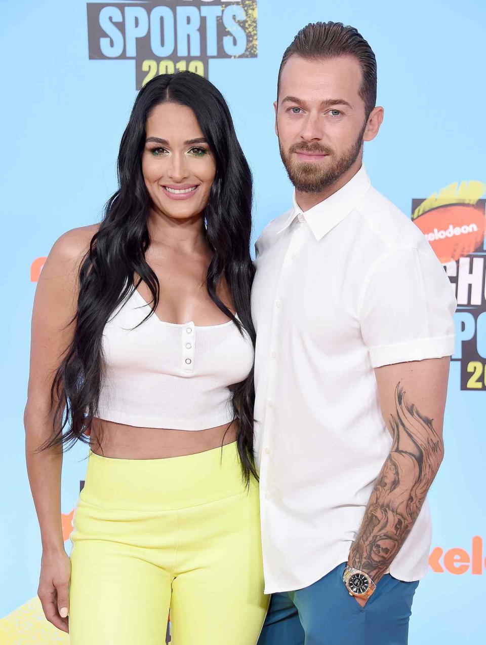 Nikki Bella and Artem Chigvintsev attend Nickelodeon Kids' Choice Sports 2019 at Barker Hangar on July 11, 2019 in Santa Monica, California