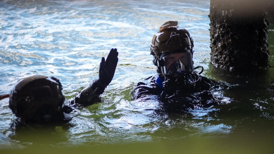 Utilitiesman 2nd Class Logan Littrell, left, and Equipment Operator 2nd Class Eric Hight, assigned to Underwater Construction Team 1, conduct pier repair in Norfolk, Va., during Large Scale Exercise 2023. (MC3 Max Biesecker/Navy)