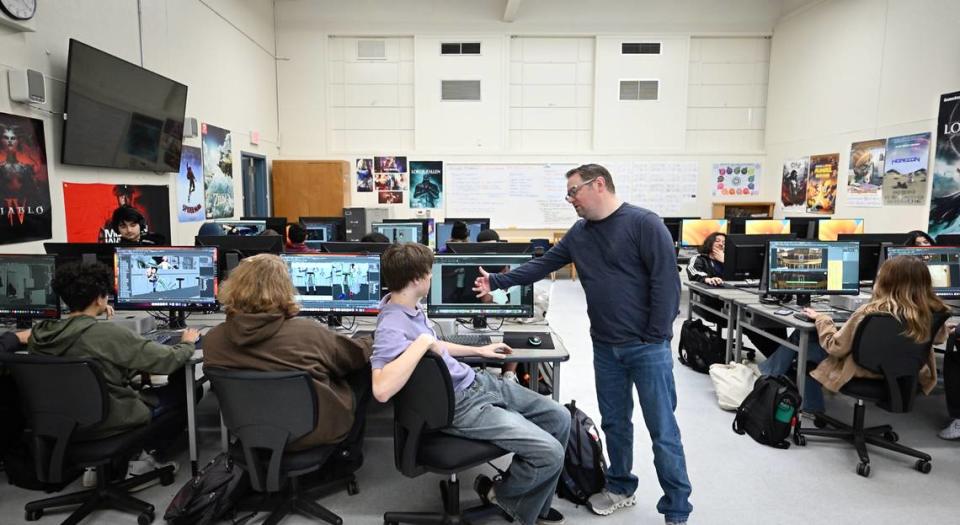 Animation teacher Heath Grant works with students on a film during the advanced animation class at Downey High School in Modesto, Calif., Thursday, April 4, 2024.