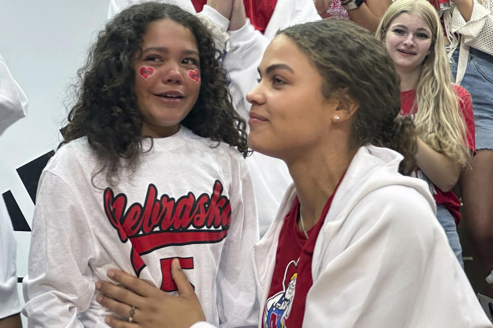 Neveah Kehr, 10, of Bismarck, North Dakota, meets her favorite Nebraska volleyball player Bekka Allick at a pep rally at Nebraska Coliseum in Lincoln, Neb., Wednesday, Aug. 30, 2023. An attendance record of global proportions could be set Wednesday night when the University of Nebraska hosts a celebration of volleyball at Memorial Stadium. (AP Photo/Eric Olson)