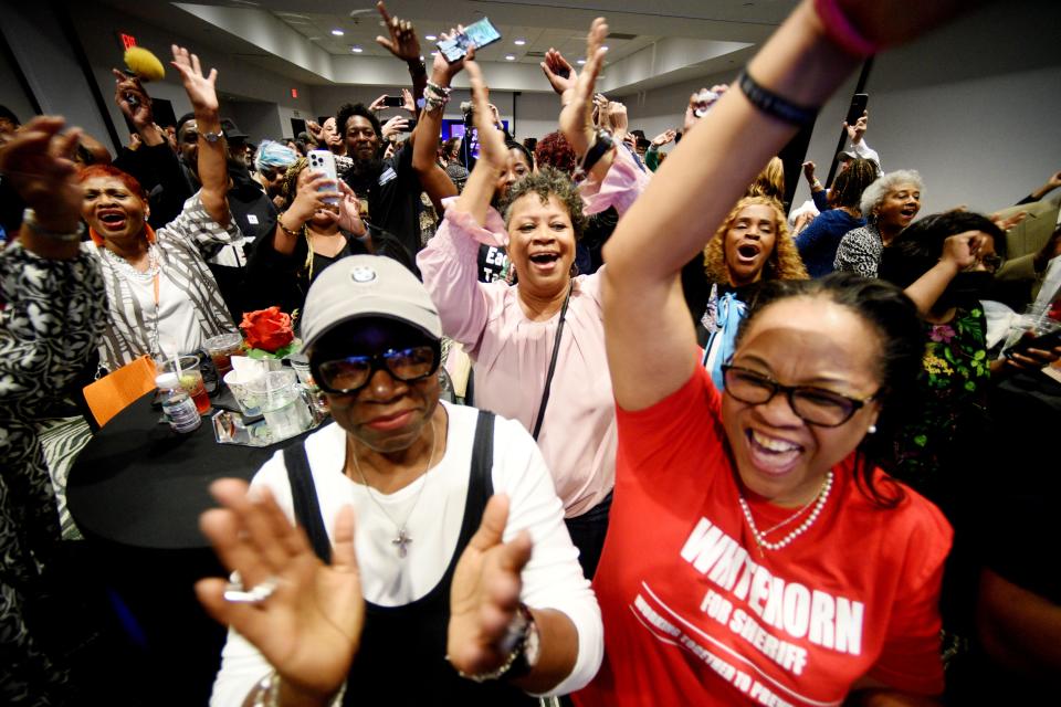 Mary Pickens (center) is surrounded by others as they celebrate at the Henry Whitehorn watch party for Caddo Sheriff election results, Saturday evening, March 23, 2024, at Hilton Shreveport.