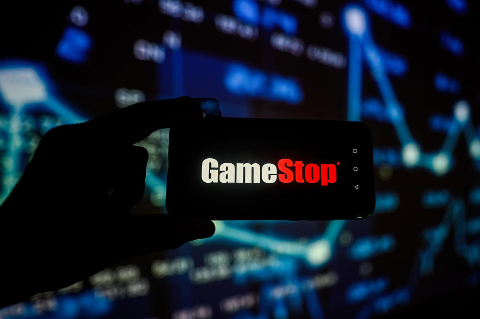 POLAND - 2023/12/01: In this photo illustration, a Game Stop logo is displayed on a smartphone with stock market percentages in the background. (Photo Illustration by Omar Marques/SOPA Images/LightRocket via Getty Images)