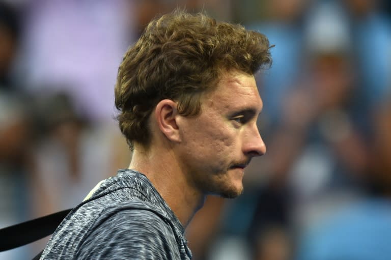 Uzbekistan's Denis Istomin leaves the court after defeat in the fourth round of the Australian Open to Bulgaria's Grigor Dimitrov on January 23, 2017