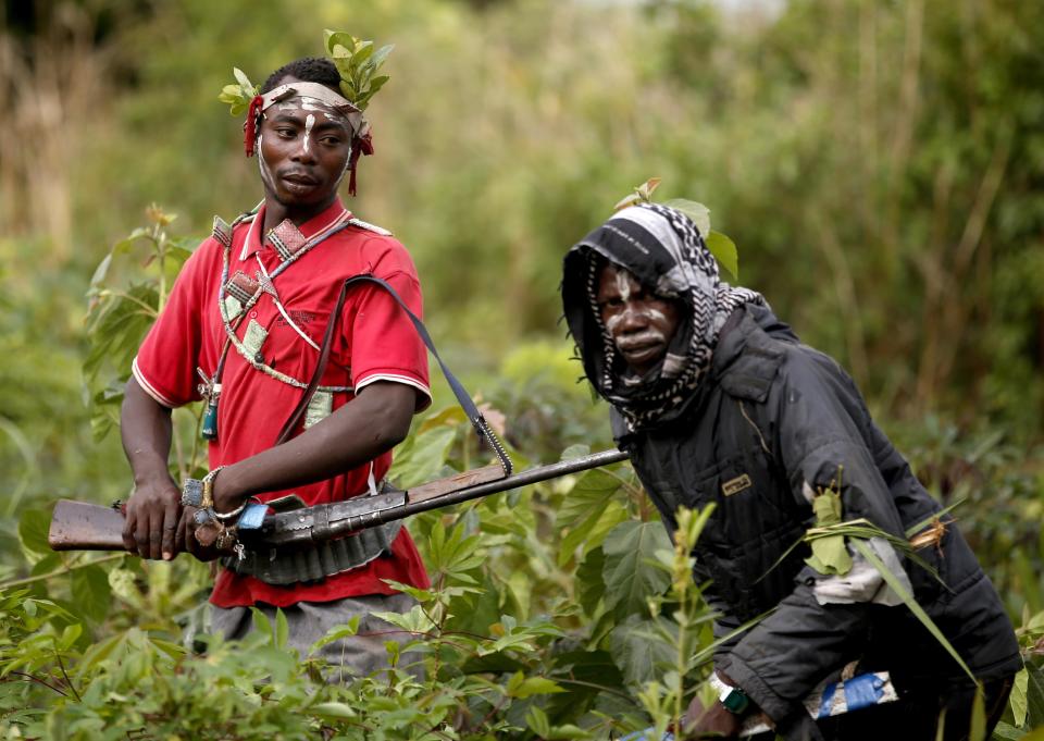 Members of the anti-balaka, a Christian militia, patrol outside the village of Zaw