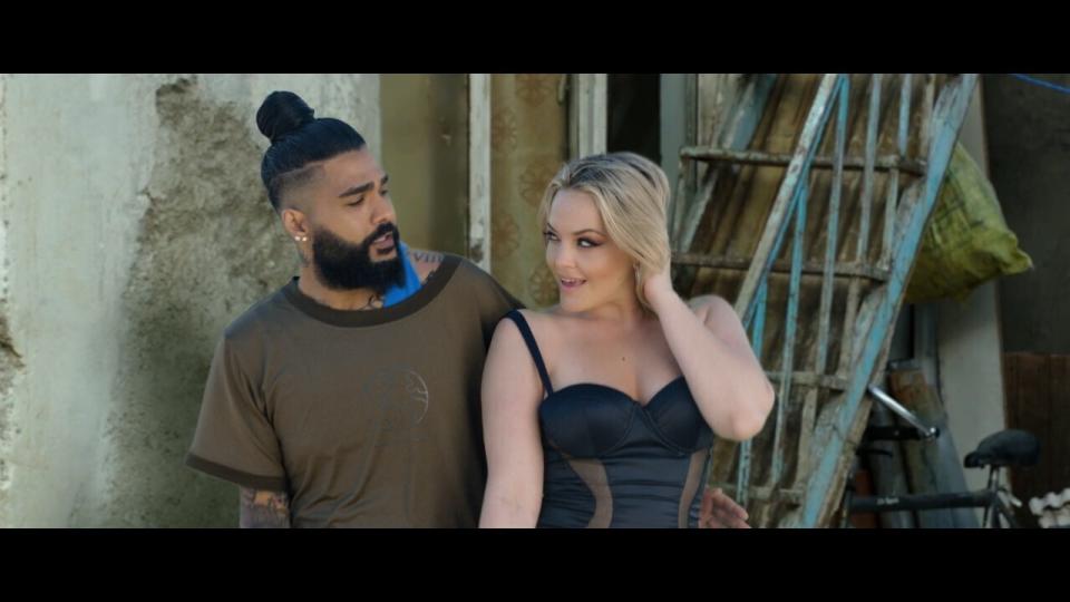 This photo provided by AZ Films shows California based Iranian pop singer Sasy with American adult film actress Alexis Texas in the music video for "Tehran Tokyo." on Feb 26, 2021 in Los Angeles. Iranian authorities have arrested multiple music producers connected to the California-based Iranian pop singer, his management company and Iranian media said Thursday, March 11, in Tehran’s latest effort to halt what it deems decadent Western behavior. (AZ Films via AP)