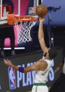 Boston Celtics forward Jayson Tatum (0) scores during the first quarter of Game 4 of an NBA basketball first-round playoff series against the Philadelphia 76ers, Sunday, Aug. 23, 2020, in Lake Buena Vista, Fla. (Kim Klement/Pool Photo via AP)