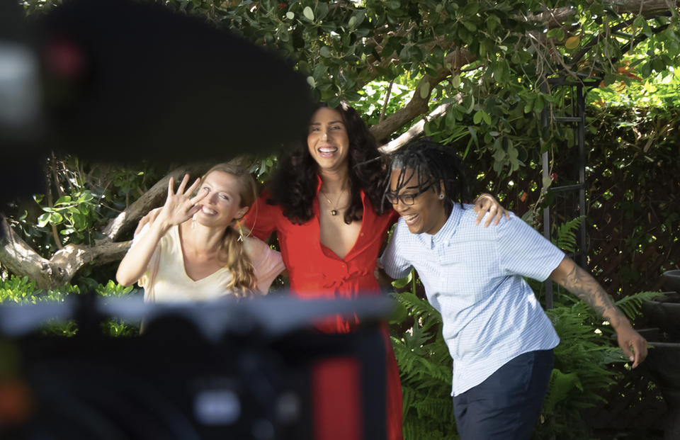 This image released by Focus Features shows Alicia Roth Weigel, from left, River Gallo and Sean Saifa Wall during the filming of the documentary "Every Body." (Focus Features via AP)