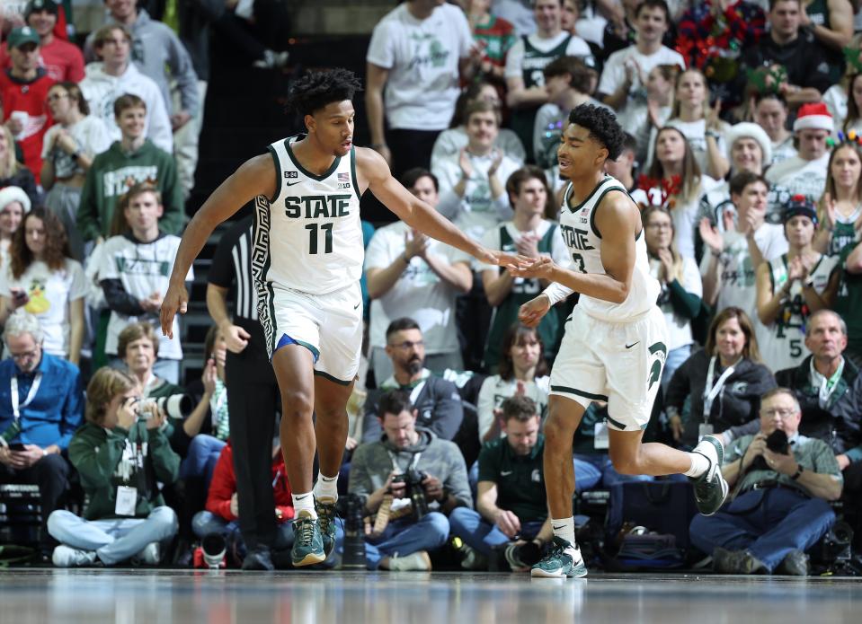Michigan State guard A.J. Hoggard, left, celebrates with Jaden Akins in the second half of the 68-50 win over Brown on Saturday, Dec. 10, 2022, at Breslin Center.