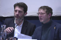 Ariel Weil, right, mayor of Paris' central district, and Pierre Rabadan, deputy mayor of Paris in charge of the Olympic Games, answer questions during a meeting with Parisians at a Paris town hall, Thursday, Feb.8, 2024. Officials spent more than two hours explaining the security, traffic and other arrangements that will be in place and took questions. Paris officials, Games organizers and government ministries are in the midst of concerted campaigns to explain to Parisians how the July 26-Aug.11 Summer Olympics and Paralympics that follow will impact their lives and how they can adapt. (AP Photo/John Leicester)