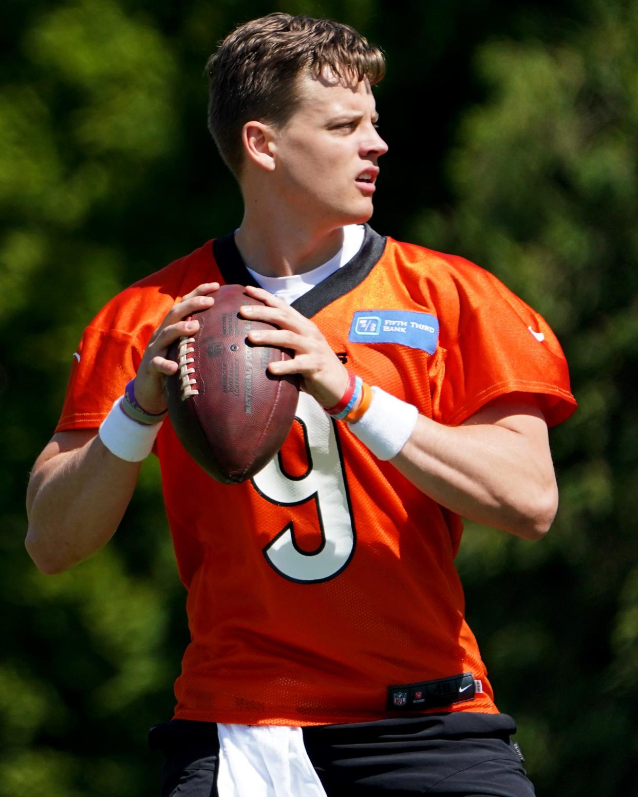 Cincinnati Bengals quarterback Joe Burrow (9) throws during practice, Tuesday, May 17, 2022, at the Paul Brown Stadium practice fields in Cincinnati. 