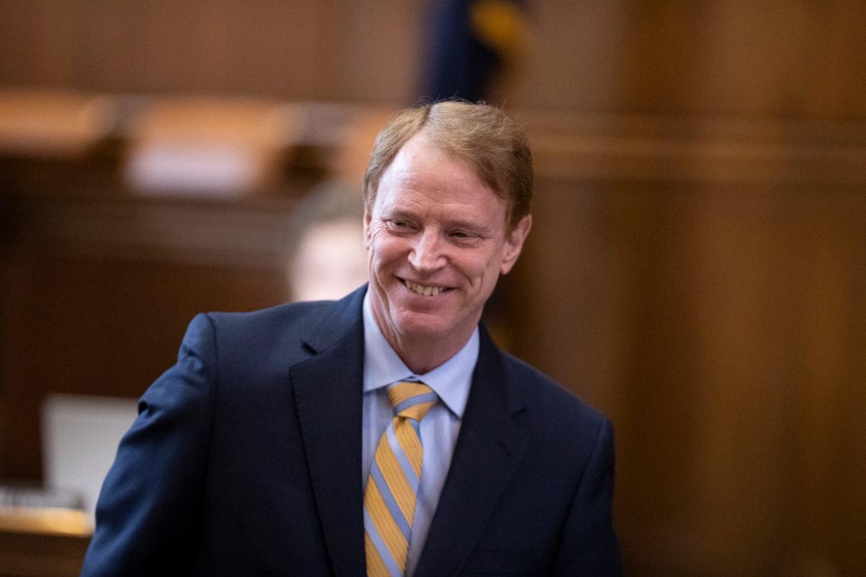 Sen. Tim Knopp, R-Bend, talks to other senators Jan. 9 at the Oregon State Capitol.