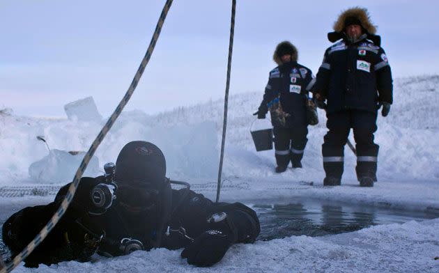 Alexander Gubin, 43, prepares to dive into the frozen Labynkyr lake, some 100 km south from Oymyakon. Picture: Reuters