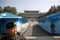 FILE PHOTO: South Korean soldiers stand guard at the truce village of Panmunjom