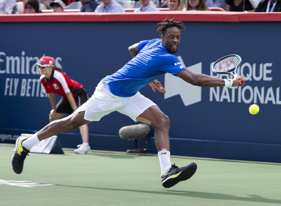 Gael Monfils, of France, returns to Roberto Bautista Agut, of Spain, during the Rogers Cup men’s tennis tournament Saturday Aug. 10, 2019, in Montreal.(Paul Chiasson/The Canadian Press via AP)