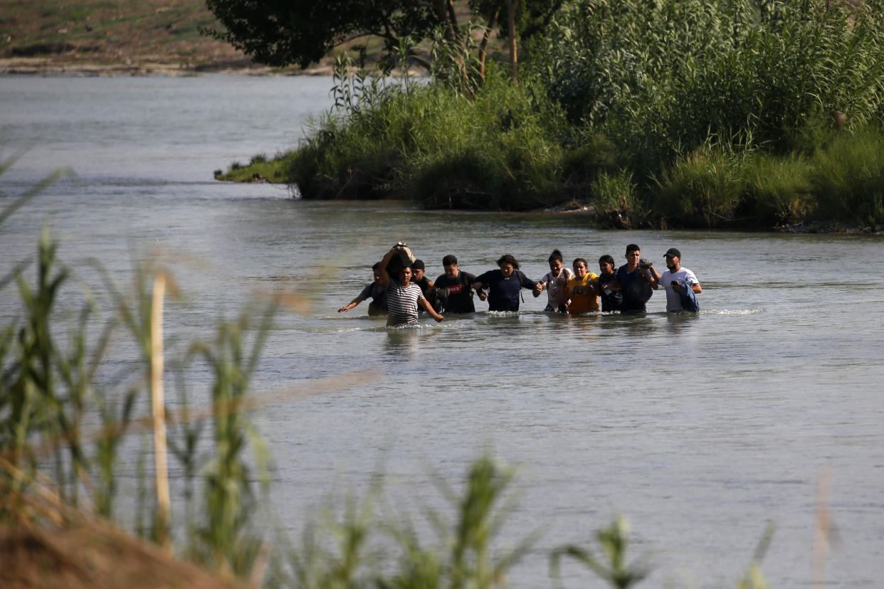 Migrants, mostly from Nicaragua, cross the Rio Grande River into the U.S., in Eagle Pass, Texas, Friday, May 20, 2022. The Eagle Pass area has become an increasingly popular crossing corridor for migrants, especially those from outside Mexico and Central America, under Title 42 authority, which expels migrants without a chance to seek asylum on grounds of preventing the spread of COVID-19. (Dario Lopez-Mills/AP)