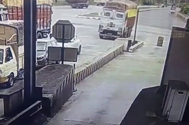 Truck loses control and rams into multiple vehicles at toll booth in southern India