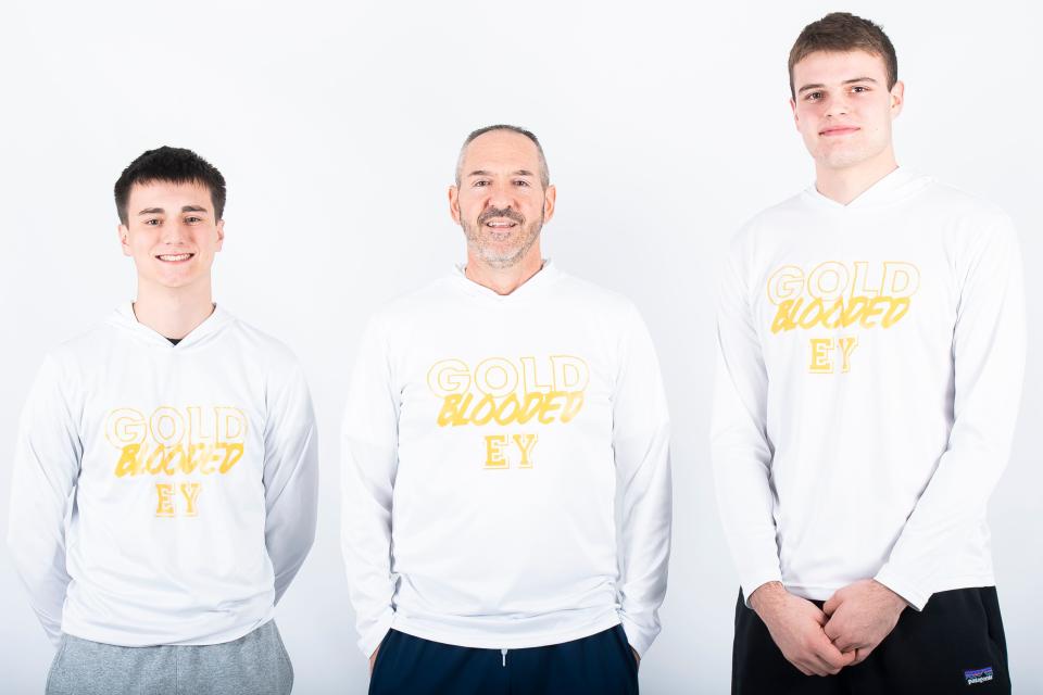 First-year Eastern York basketball head coach Troy Sowers poses for a photo with juniors Brady Seitz (left) and Carter Wamsley (right) during YAIAA winter sports media days Wednesday, November 8, 2023, in York.