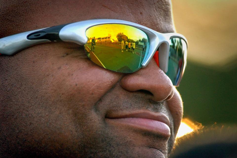 Spencer Tatum, a now-retired Worcester officer who has battled the city and the state in court over civil service exams for decades, is one of about 600 officers of color expected to be compensated for an exam process a judge found to be discriminatory. Tatum watches the action during a Police Athletic League Gang Unit basketball final at Beaver Brook Park in Worcester in this 2005 photo.