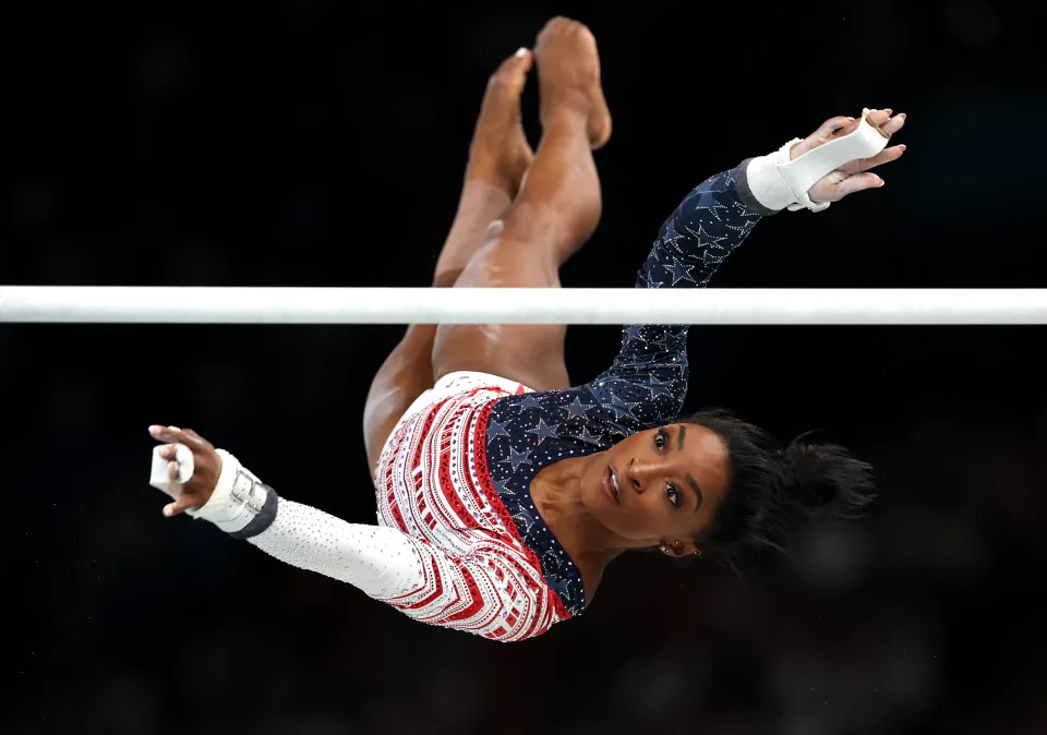 PARIS, FRANCE - JULY 30: Simone Biles of Team United States competes on the uneven bars during the Artistic Gymnastics Women's Team Final on day four of the Olympic Games Paris 2024 at Bercy Arena on July 30, 2024 in Paris, France. (Photo by Jamie Squire/Getty Images)