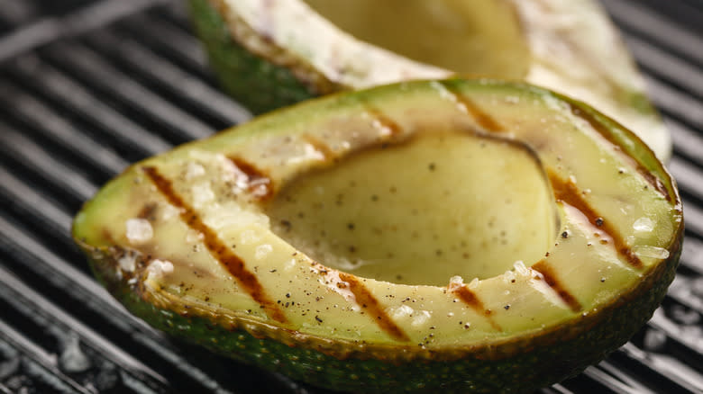 Sliced avocado on a grill 