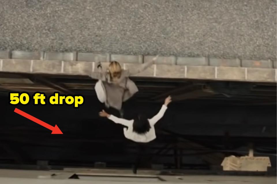 two girls jumping from a roof with caption "50ft drop"