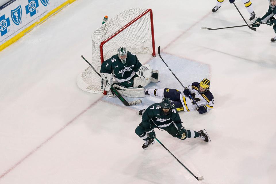 Michigan State goaltender Trey Augustine defends the goal against Michigan during the second period at Yost Ice Arena in Ann Arbor on Friday, Feb. 9, 2024.