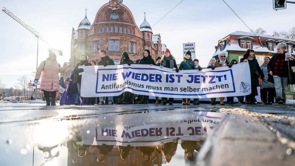 People hold a banner that reads: "Never again is now! You have to do anti-fascism yourself," in Erfurt on Saturday. - Jacob Schroeter/dpa/AP