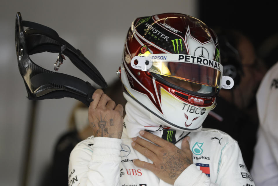 Mercedes driver Lewis Hamilton, of Britain, prepares to drive during the second practice session for the Formula One U.S. Grand Prix auto race at the Circuit of the Americas, Friday, Nov. 1, 2019, in Austin, Texas. (AP Photo/Darron Cummings)