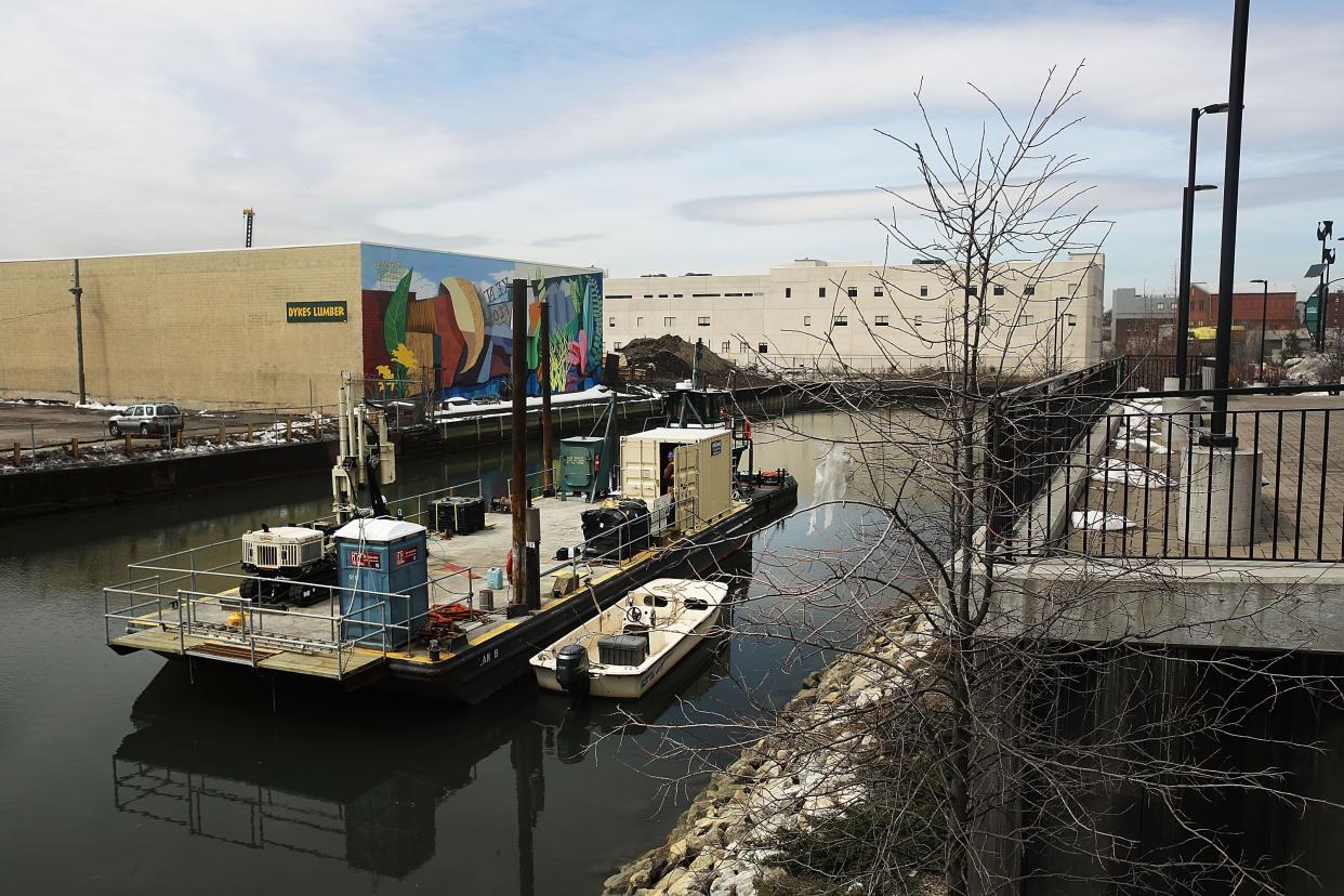 In this file photo, a boat works on the clean-up and maintenance of the Gowanus Canal, which is a designated federal Superfund site