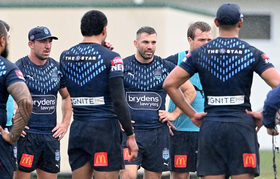 James Tedesco (pictured middle) and team mates chat during a New South Wales Blues State of Origin training session.