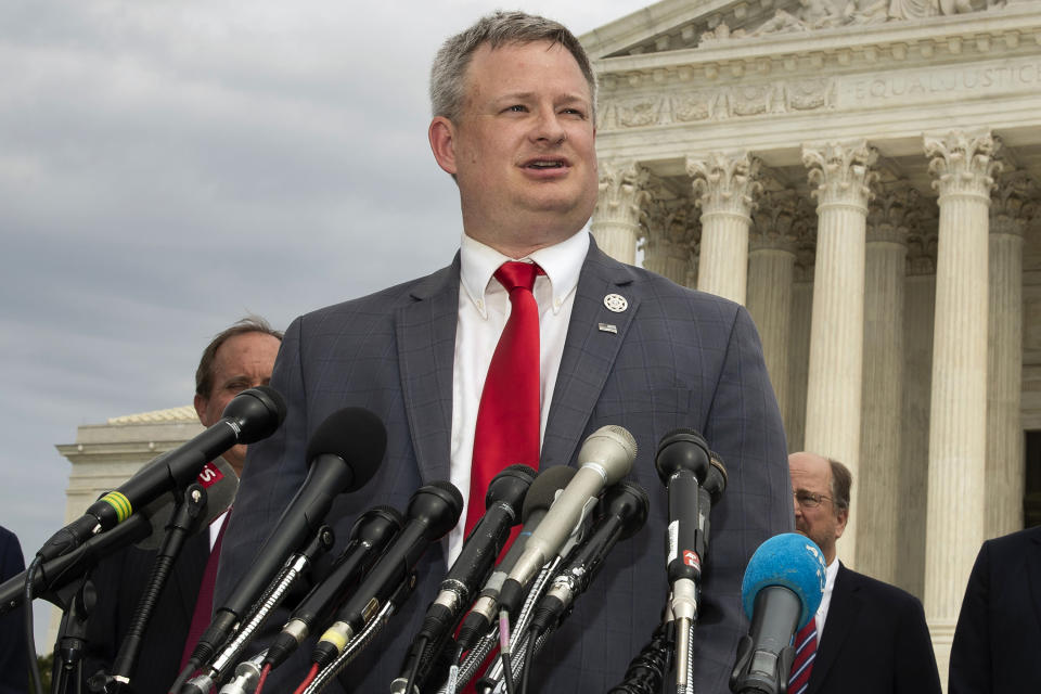 FILE - Then-South Dakota Attorney General Jason Ravnsborg speaks to reporters in front of the U.S. Supreme Court in Washington, Sept. 9, 2019. South Dakota Gov. Kristi Noem is under scrutiny from the state's Government Accountability Board for allegations she misused the powers of her office by interfering in her daughter’s application for a real estate appraiser license and flying on state-owned airplanes to political events. As attorney general, Ravnsborg last year filed the complaints against Gov. Noem to the state’s Government Accountability Board, and on Wednesday, Aug. 3, 2022, a South Dakota government ethics board pressed forward in its investigation of two complaint against the governor. (AP Photo/Manuel Balce Ceneta, File)