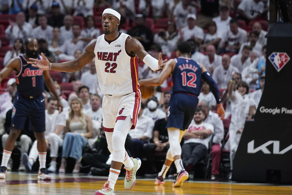 Miami Heat forward Jimmy Butler (22) celebrates after scoring during the first half of Game 5 of an NBA basketball second-round playoff series against the Philadelphia 76ers, Tuesday, May 10, 2022, in Miami. (AP Photo/Wilfredo Lee)