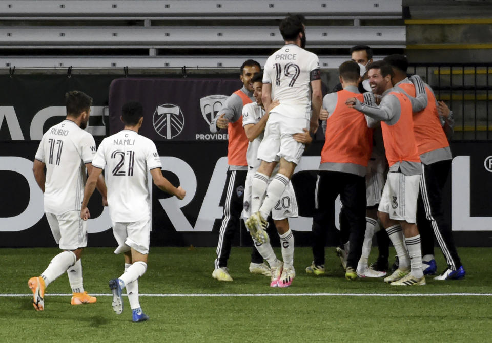 The Colorado Rapids celebrate after scoring a goal during the second half of an MLS soccer match against the Portland Timbers in Portland, Ore., Wednesday, Nov. 4, 2020. (AP Photo/Steve Dykes)