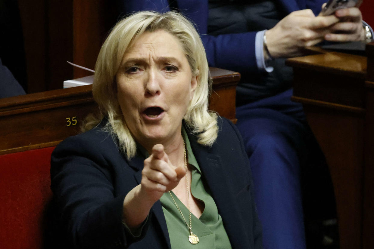 French far-right Rassemblement National (RN) parliamentary group president Marine Le Pen reacts during the debate regarding the draft law on pension system reform at the National Assembly in Paris, on February 6, 2023. - The French government's plan to reform the pension system, which includes hiking the minimum retirement age, will begin to be debated in parliament on February 6, 2023, with a third day of nationwide strikes and protest against the bill planned for February 7. (Photo by Ludovic MARIN / AFP)