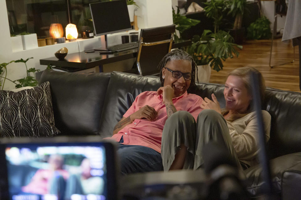 This image released by Focus Features shows Sean Saifa Wall, left, and Alicia Roth Weigel during the filming of the documentary "Every Body." (Focus Features via AP)