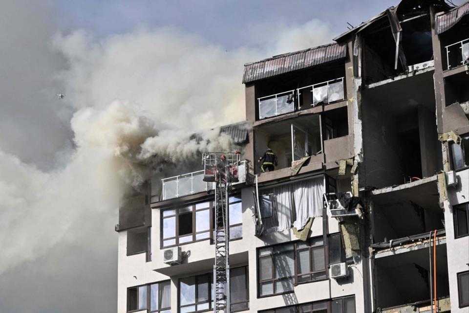 A damaged residential building, hit by Russian missiles in Kyiv on Sunday (AFP via Getty Images)