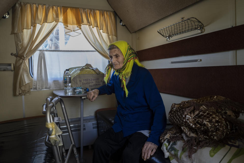 An elderly woman who has been evacuated from the Lysychansk area, sits in an evacuation train in Pokrovsk, in eastern Ukraine, Friday, June 10, 2022. (AP Photo/Bernat Armangue)