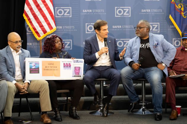 Mehmet Oz (second from right), the Republican Senate nominee, speaks at a roundtable on gun violence in northwest Philadelphia on Monday. State Rep. Chris Rabb, a Democrat and Fetterman supporter, is seated at left. (Photo: Ryan Collerd/Associated Press)